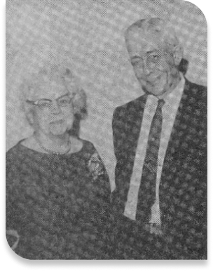 old black and white photo of elderly couple dressed nicely